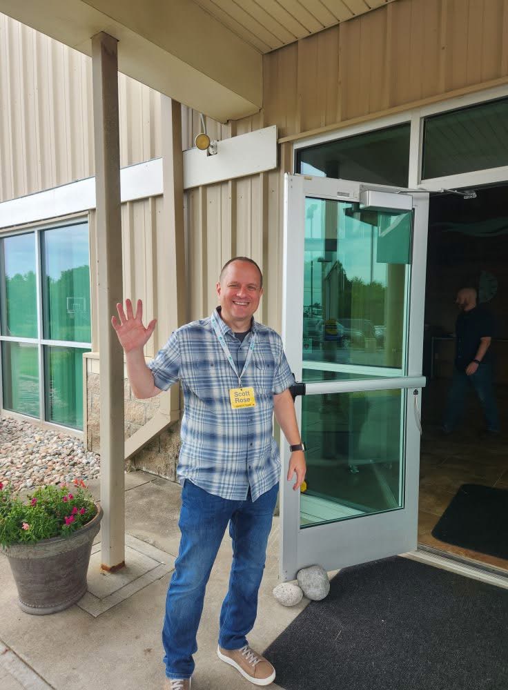 A River Bluff greeter welcoming visitors at the entrance